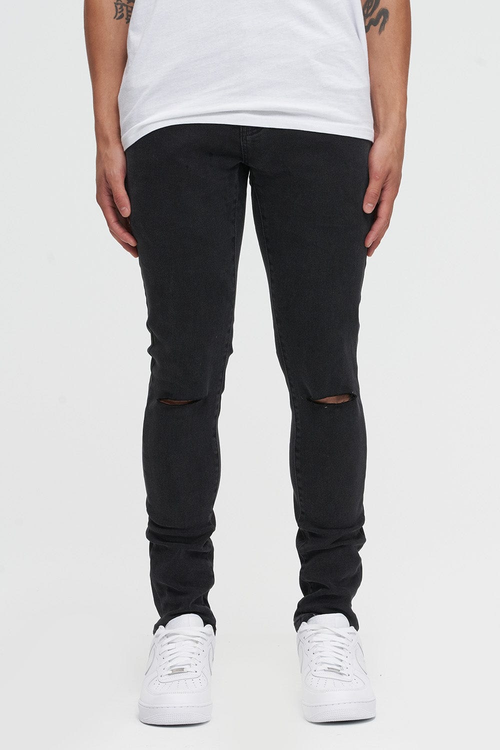 Black skinny best sale jeans knee rip